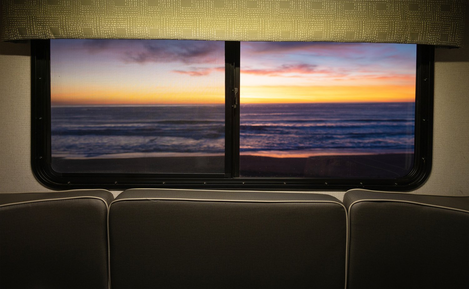 Scenic Ocean Sunset through Motor Home RV Window